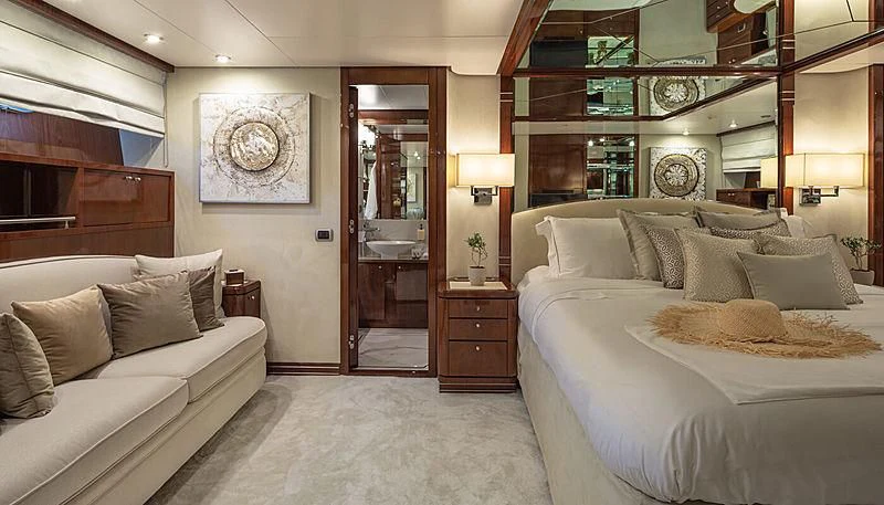 a room with a bed and a couch aboard GRACE Yacht for Sale