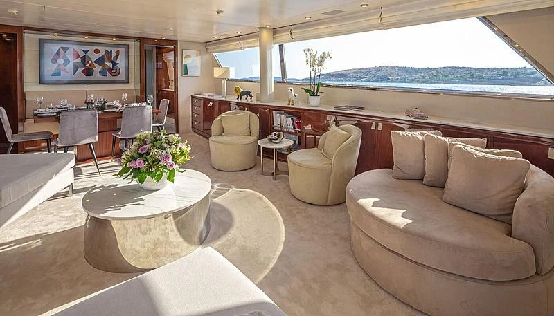a living room with a couch and a table aboard GRACE Yacht for Sale