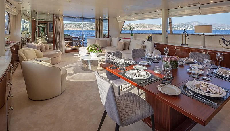 a large dining room with a large table and chairs aboard GRACE Yacht for Sale