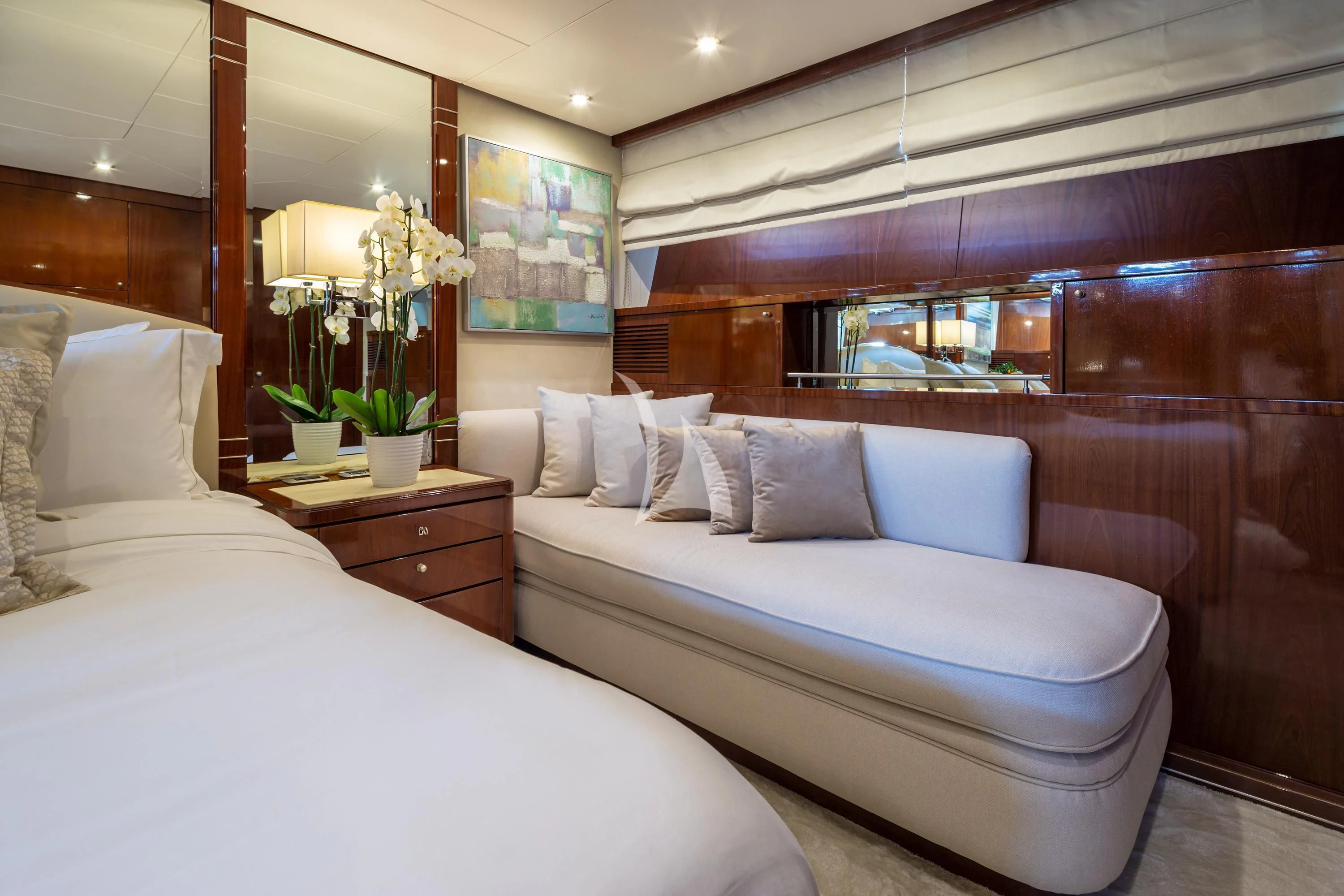 a room with a bed and a couch aboard GRACE Yacht for Sale