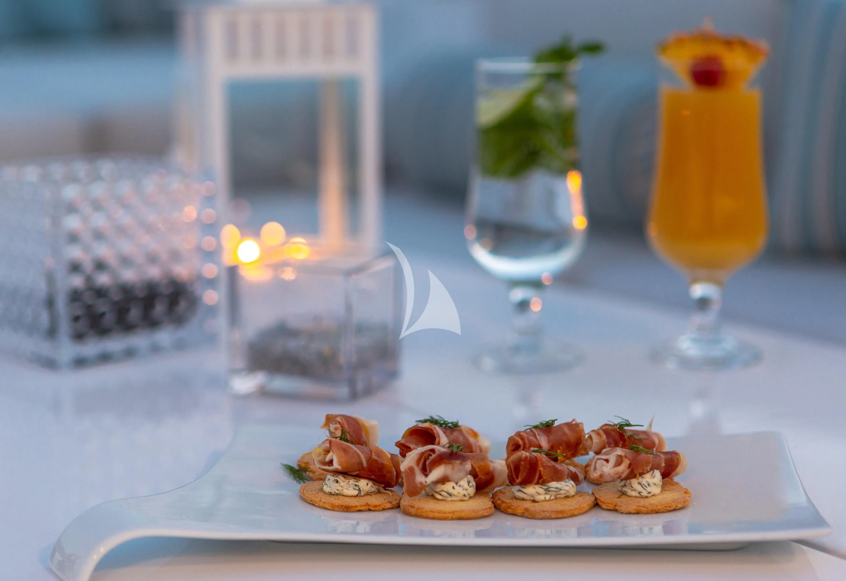 a plate of desserts and a glass of juice aboard GRACE Yacht for Sale