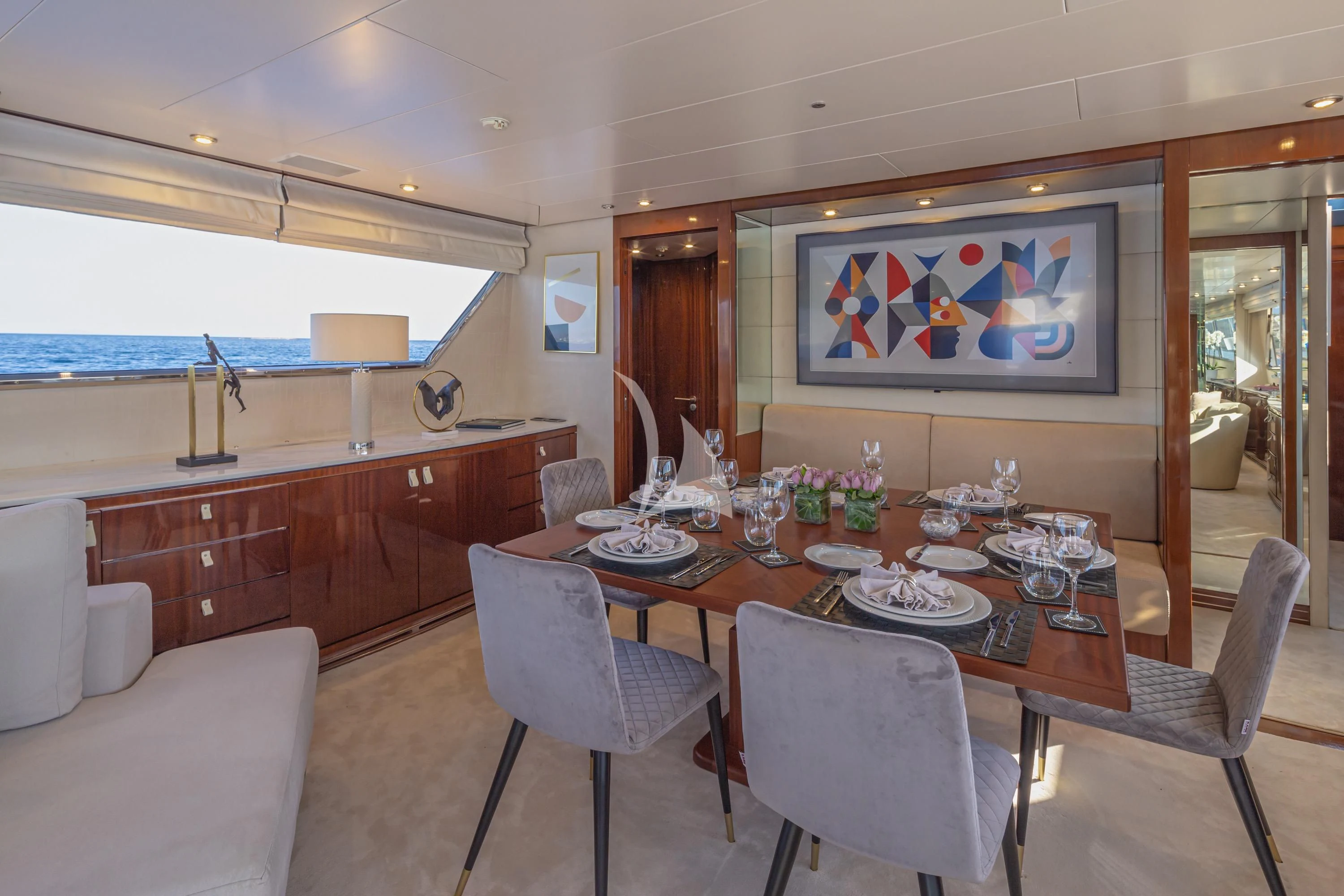 a dining room with a table and chairs aboard GRACE Yacht for Sale