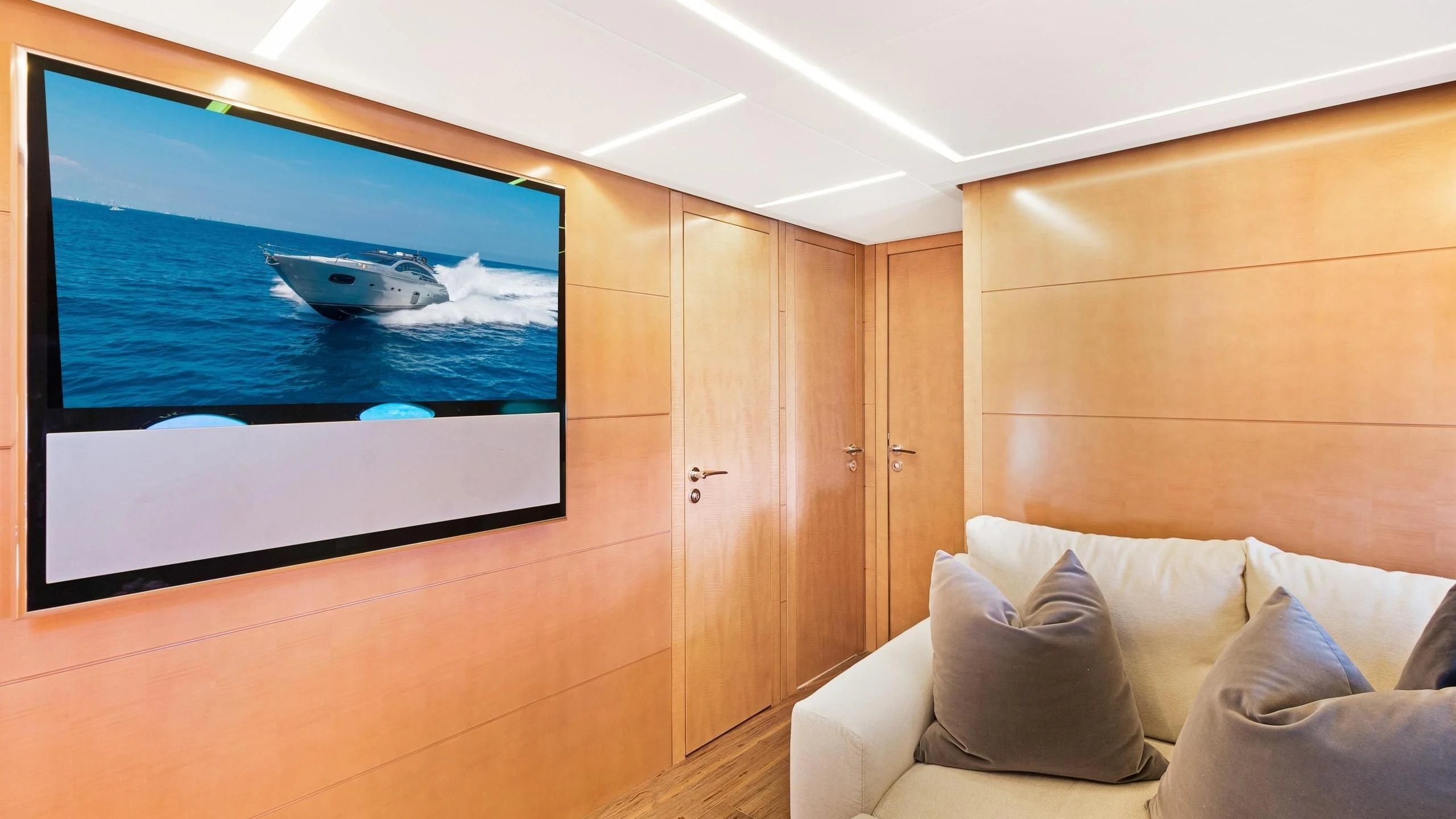 a room with a tv and a bed aboard VIXEN Yacht for Sale