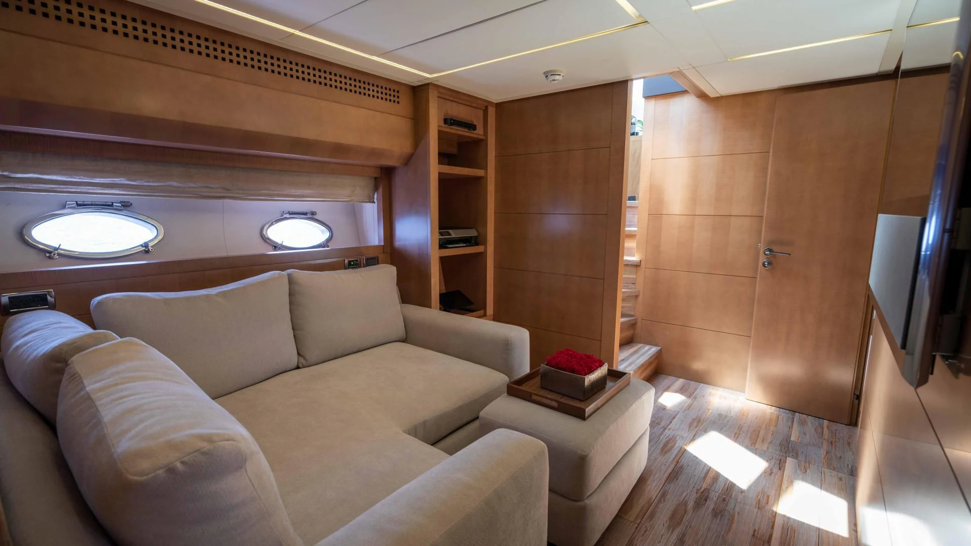 a room with a couch and a tv aboard VIXEN Yacht for Sale