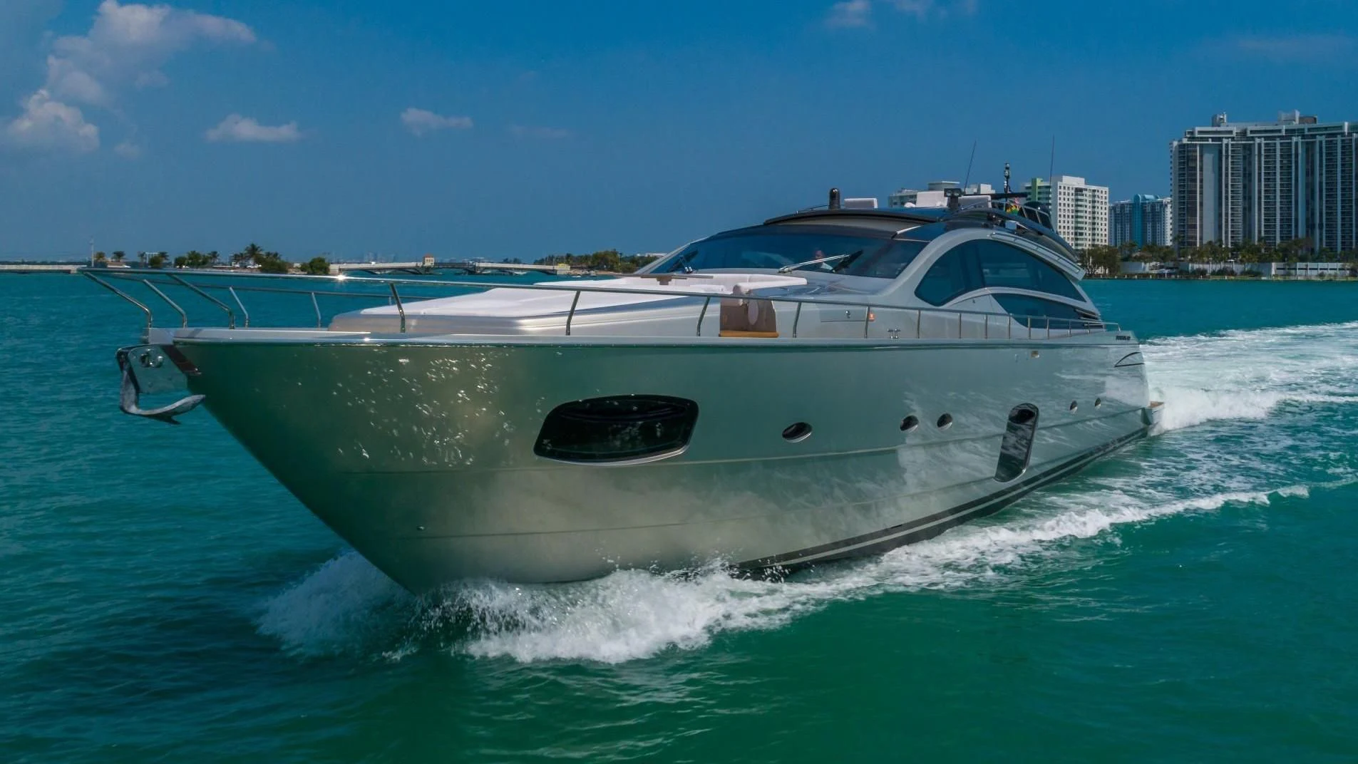 a white yacht on the water aboard VIXEN Yacht for Sale