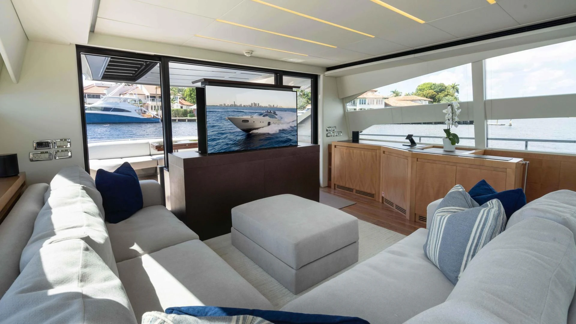 a room with a large bed and a large flat screen television aboard VIXEN Yacht for Sale