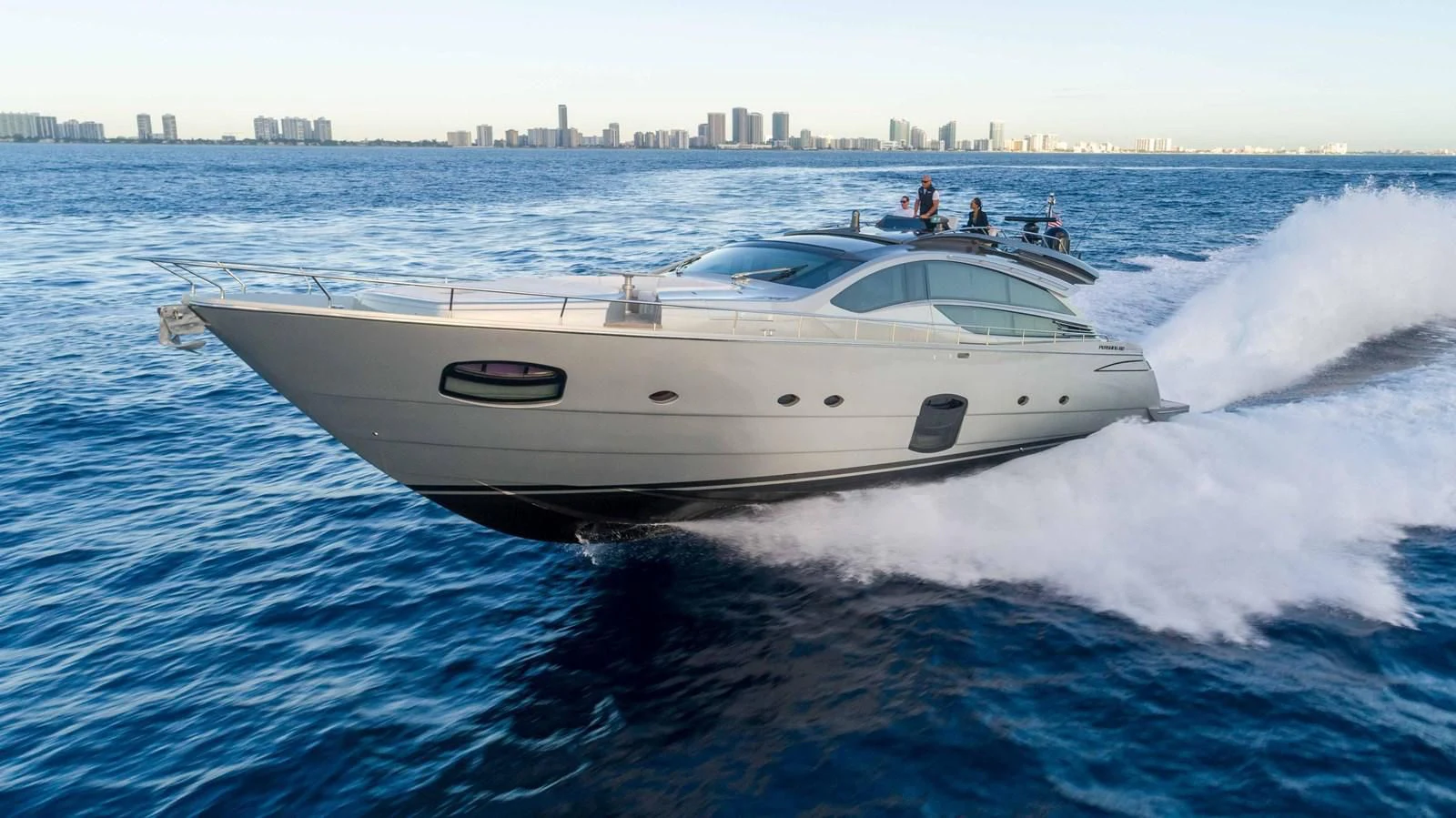 a white yacht on the water aboard VIXEN Yacht for Sale