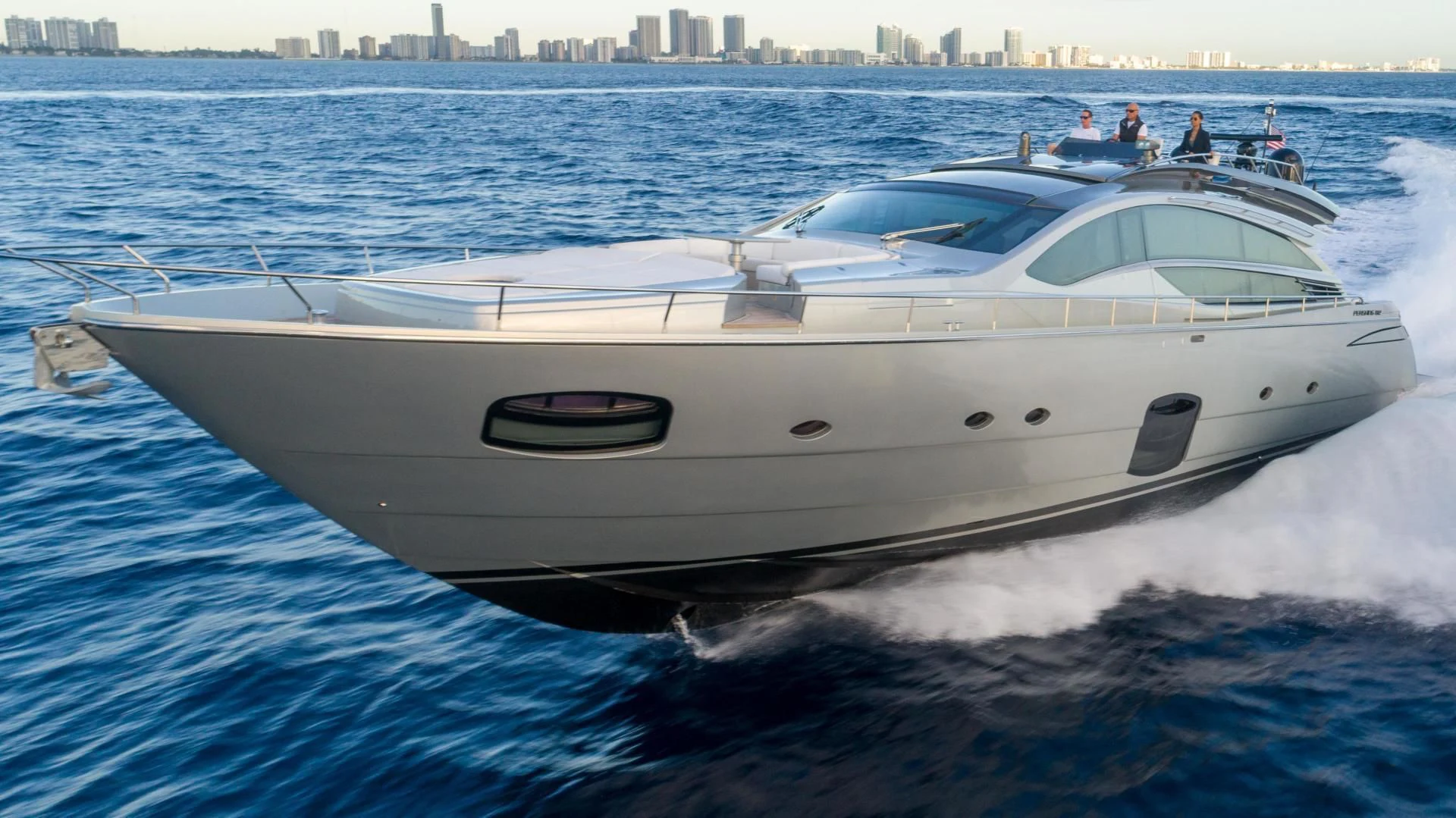 a white yacht on the water aboard VIXEN Yacht for Sale