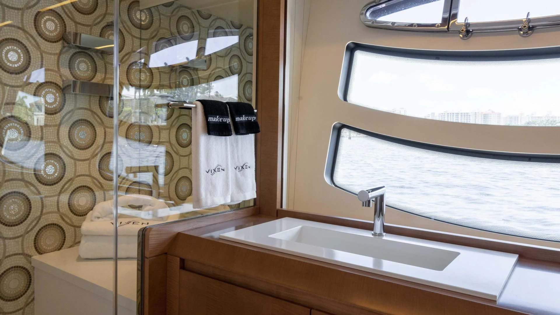 a bathroom with a sink and a mirror aboard VIXEN Yacht for Sale