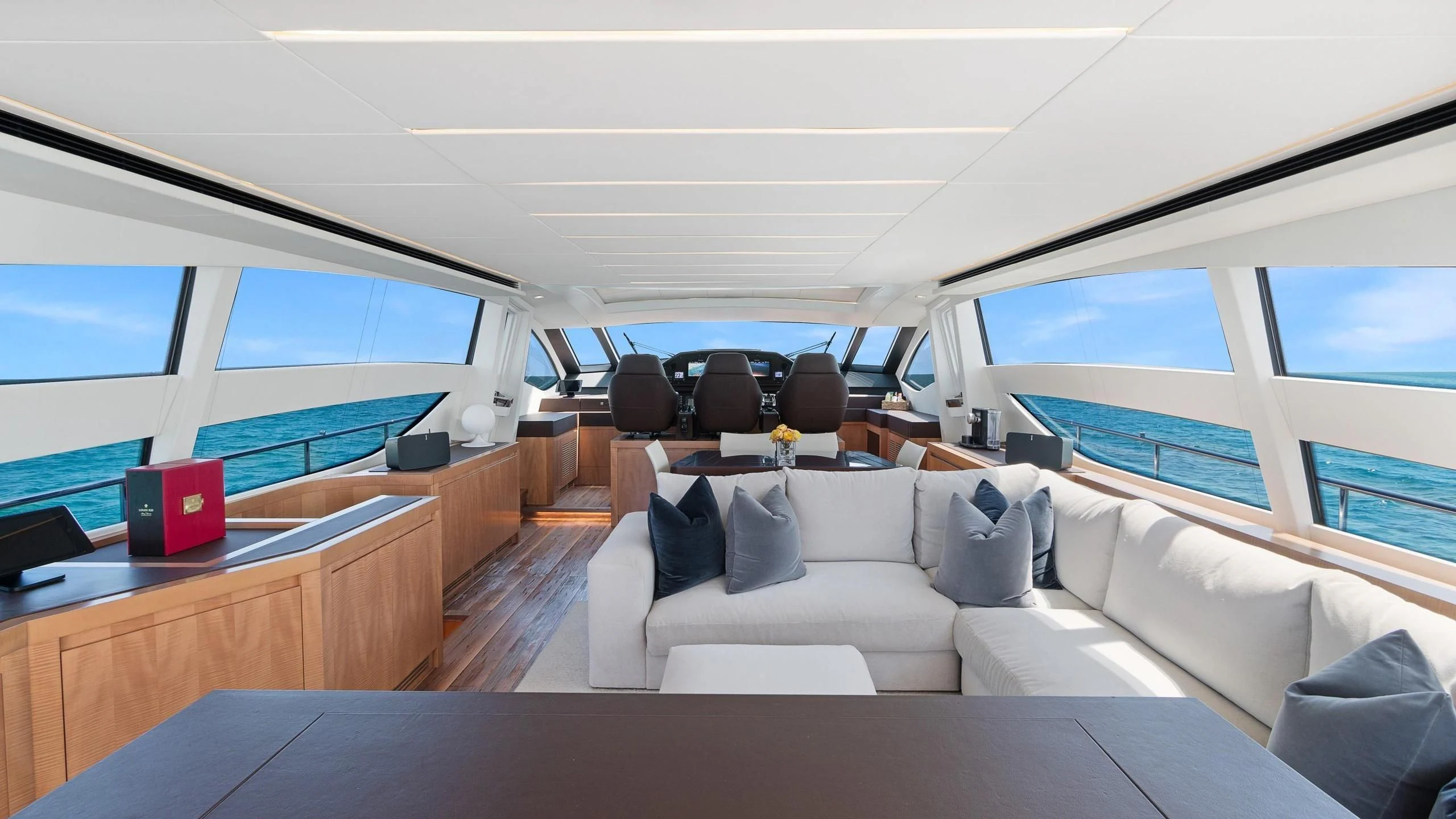a room with a couch and a laptop on a table aboard VIXEN Yacht for Sale