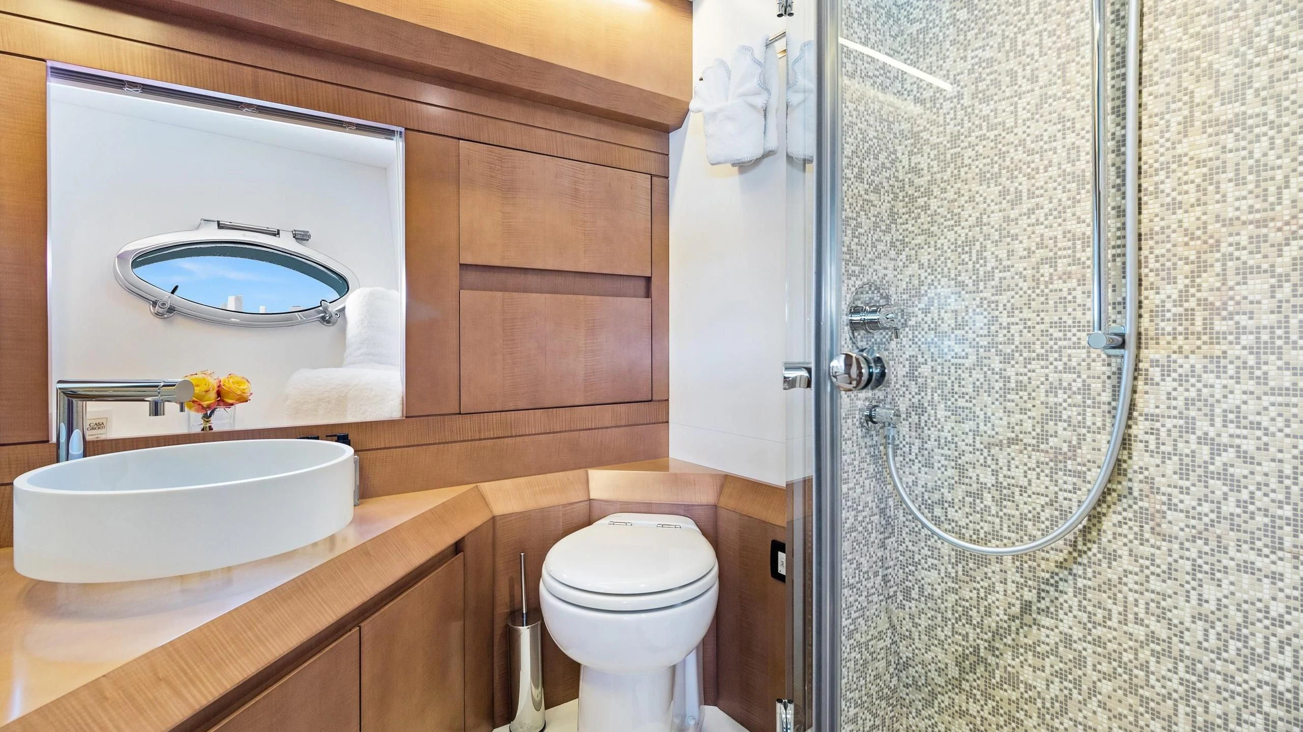 a bathroom with a sink toilet and a mirror aboard VIXEN Yacht for Sale