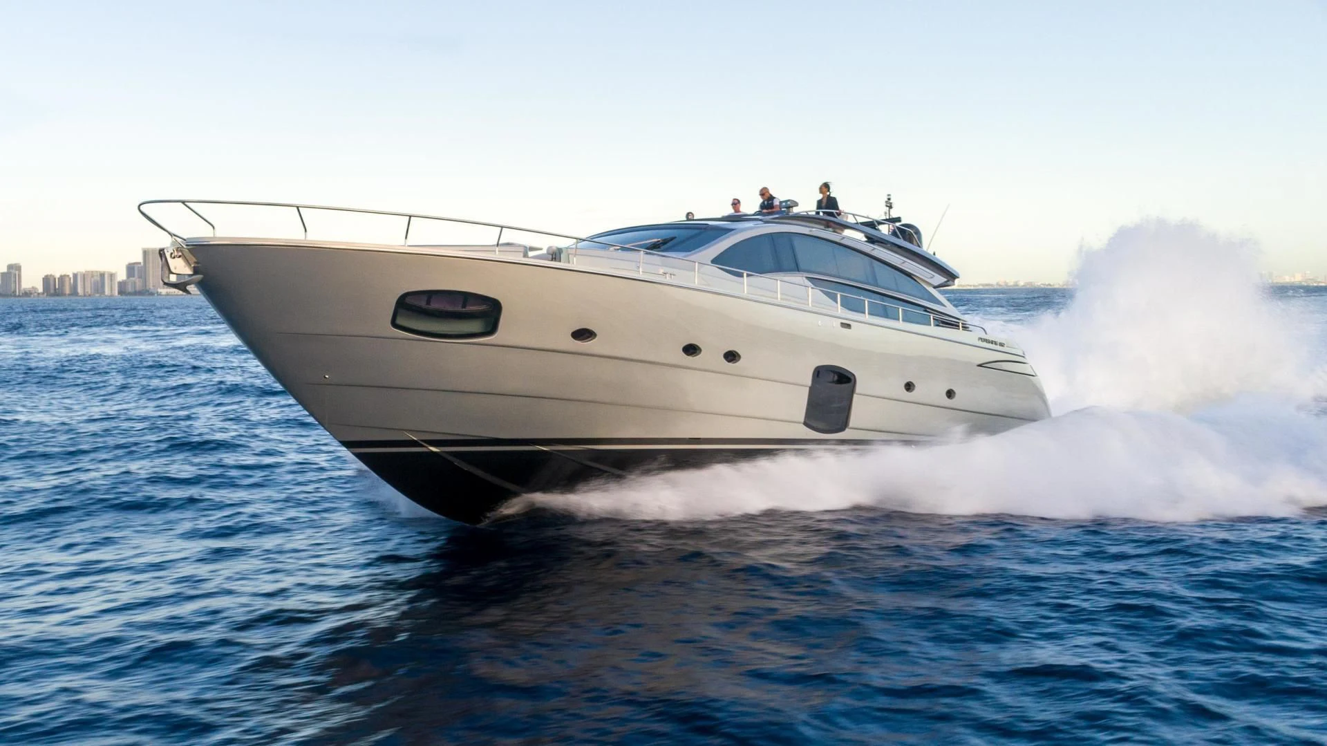 a white yacht on the water aboard VIXEN Yacht for Sale