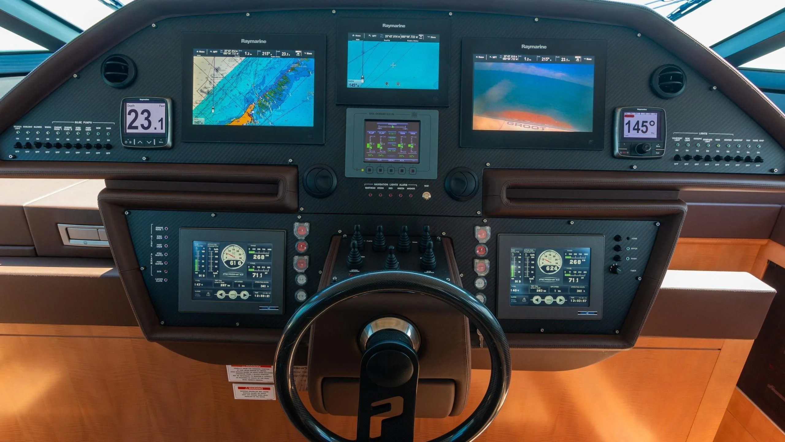 a steering wheel and dashboard of a car aboard VIXEN Yacht for Sale
