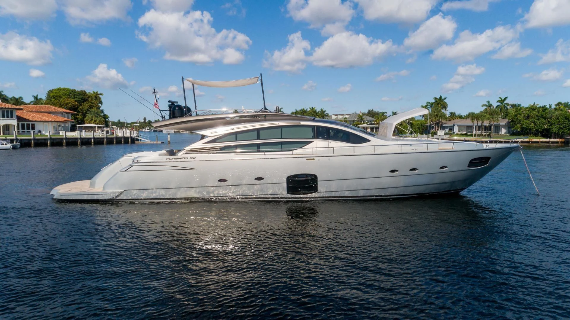 a white yacht on the water aboard VIXEN Yacht for Sale