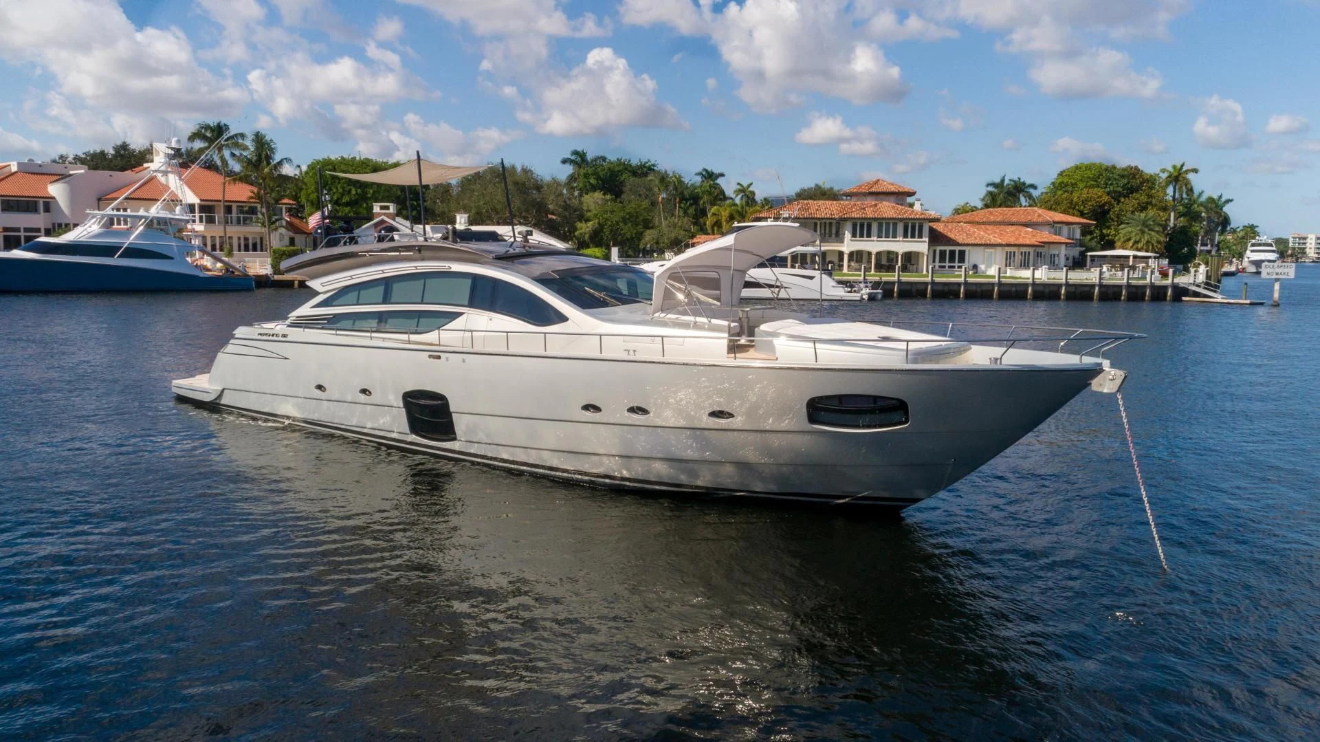 a white boat in a body of water aboard VIXEN Yacht for Sale