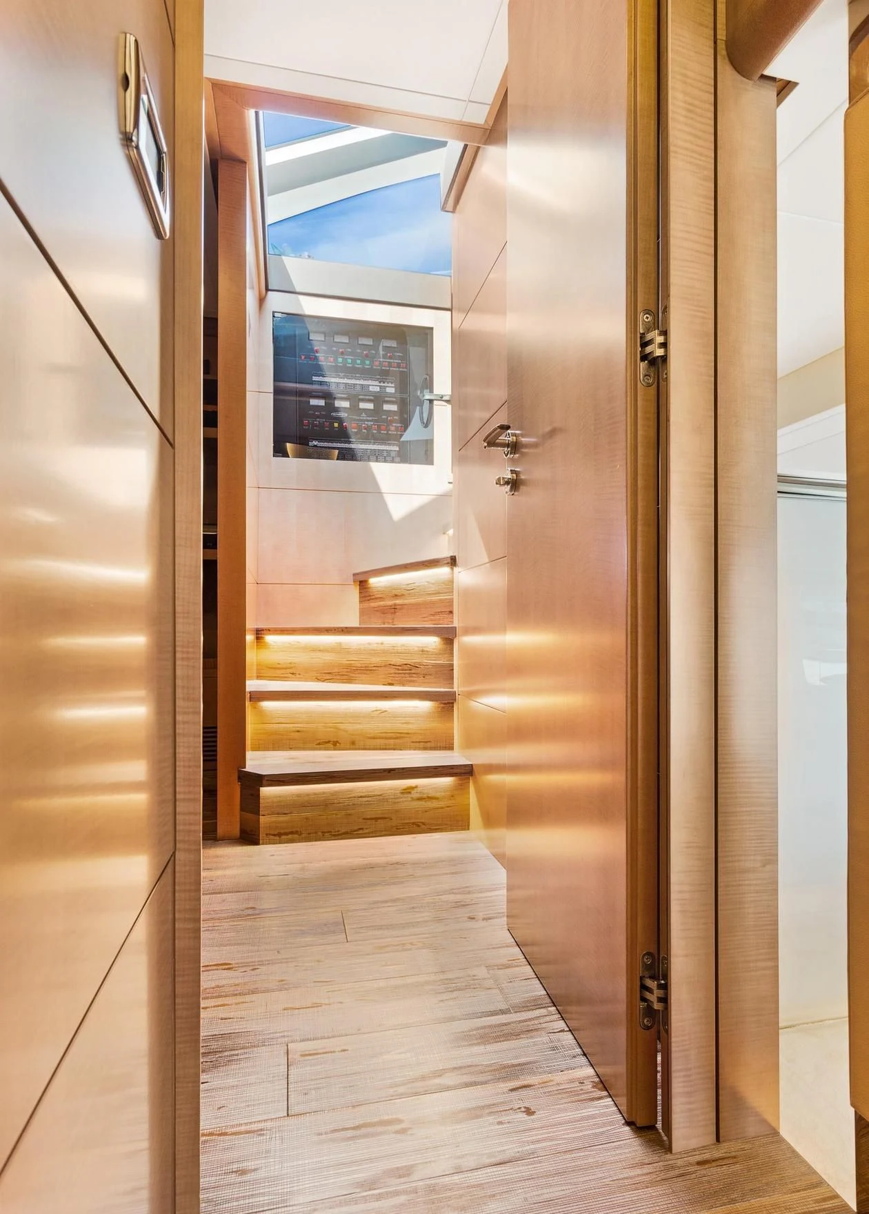 a wooden hallway with a glass door aboard VIXEN Yacht for Sale