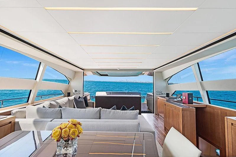 a living room with a couch and a table aboard VIXEN Yacht for Sale