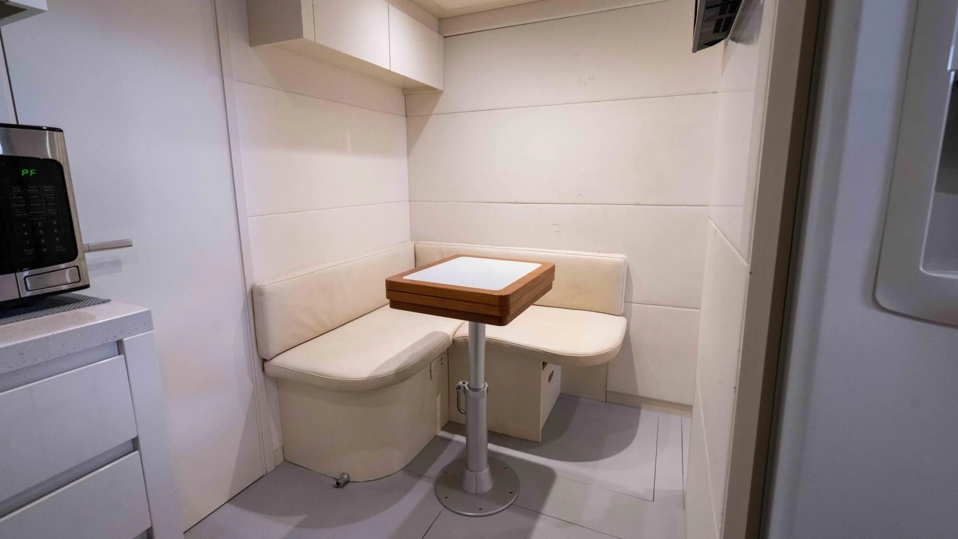 a white chair in a room aboard VIXEN Yacht for Sale