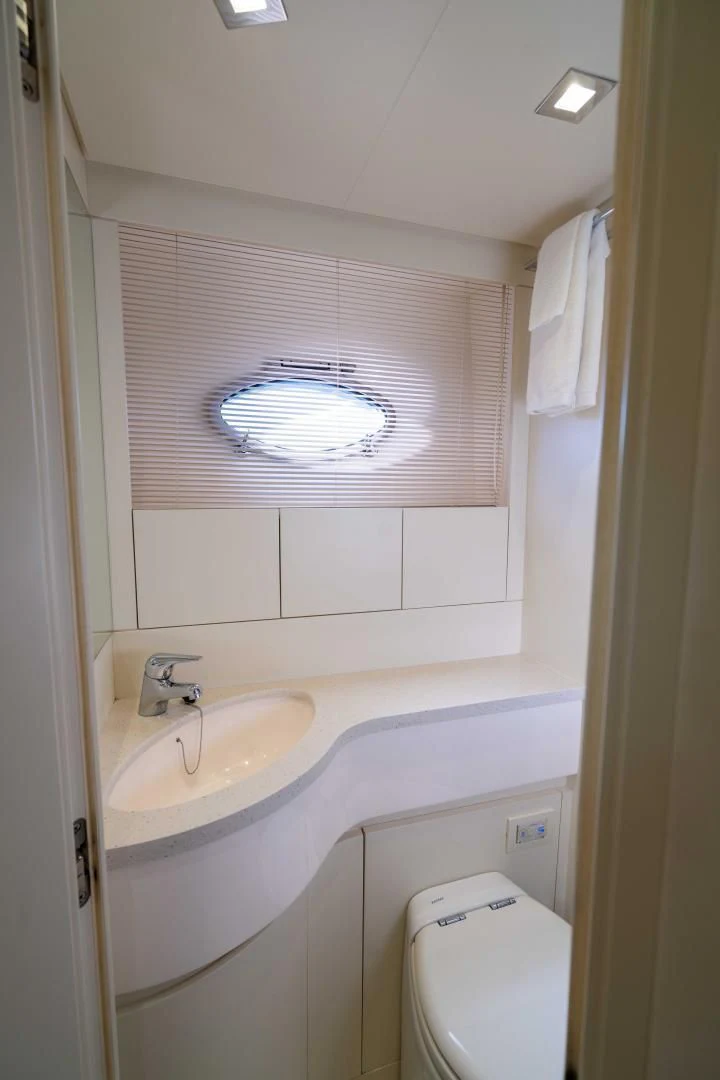 a bathroom with a sink and a toilet aboard VIXEN Yacht for Sale