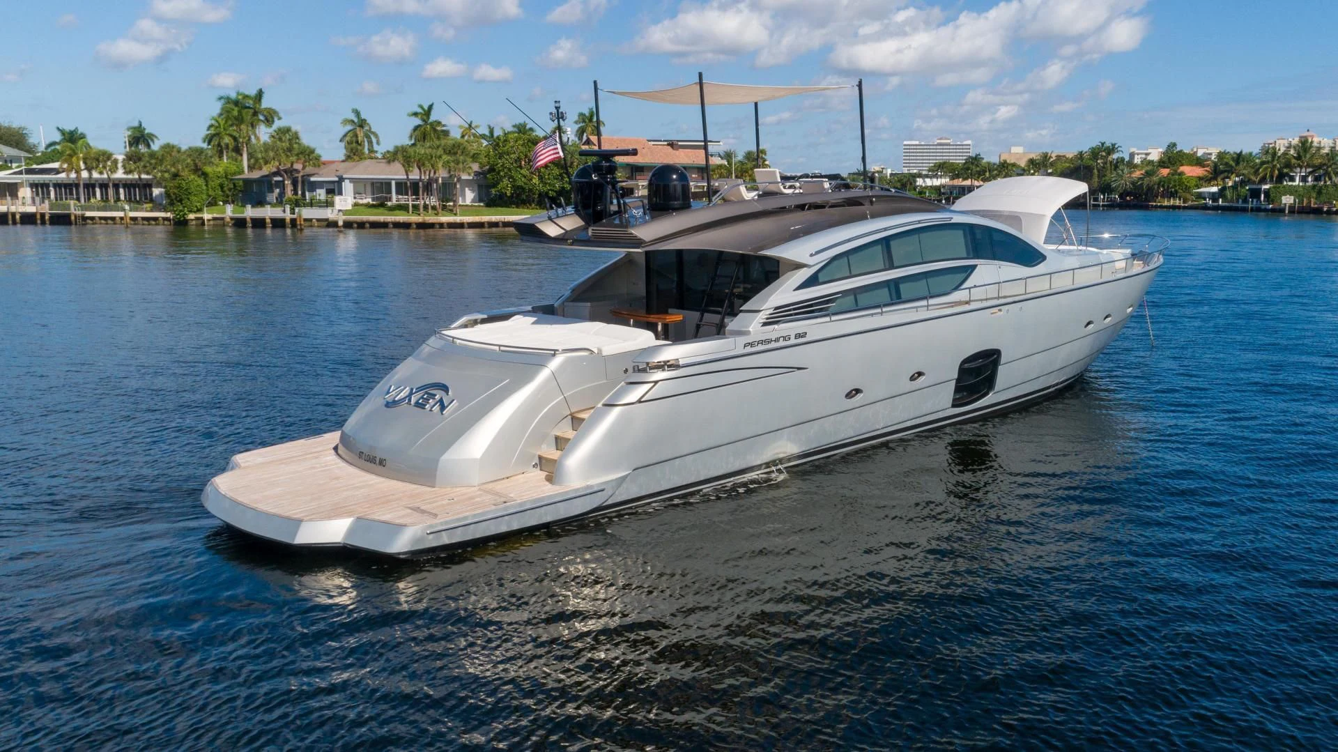 a white yacht on the water aboard VIXEN Yacht for Sale