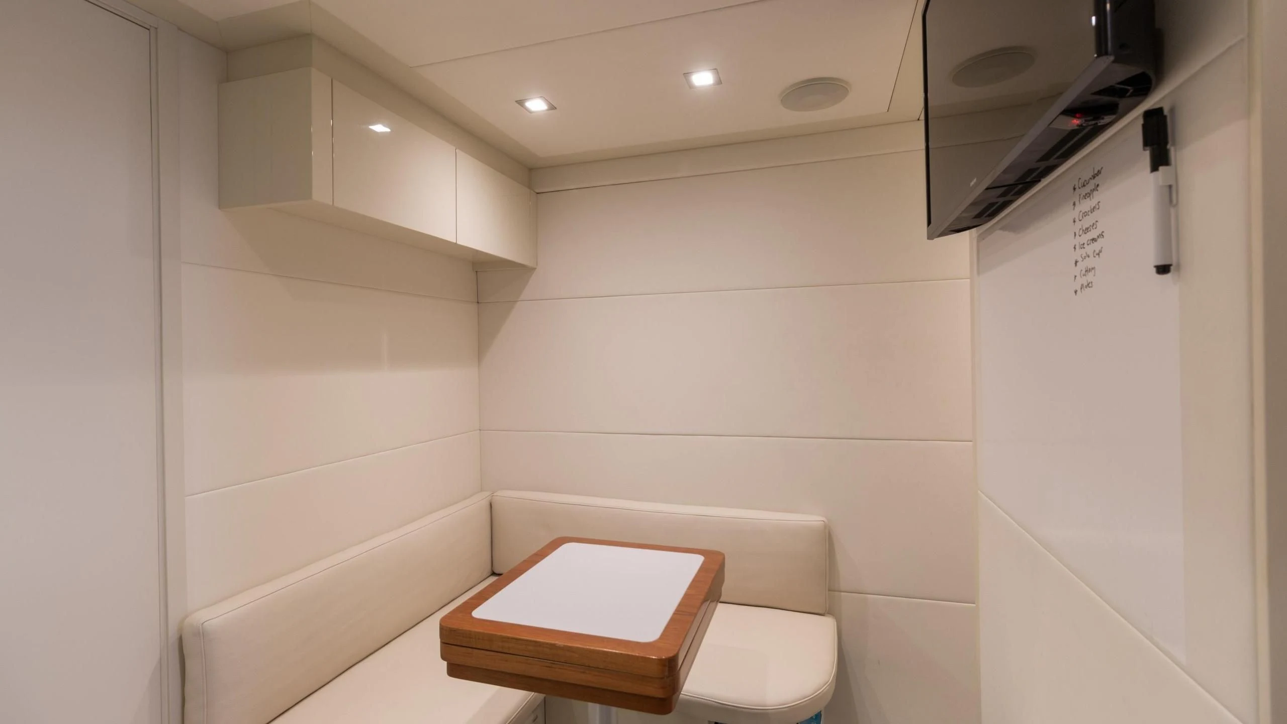 a room with a table and a toilet aboard VIXEN Yacht for Sale