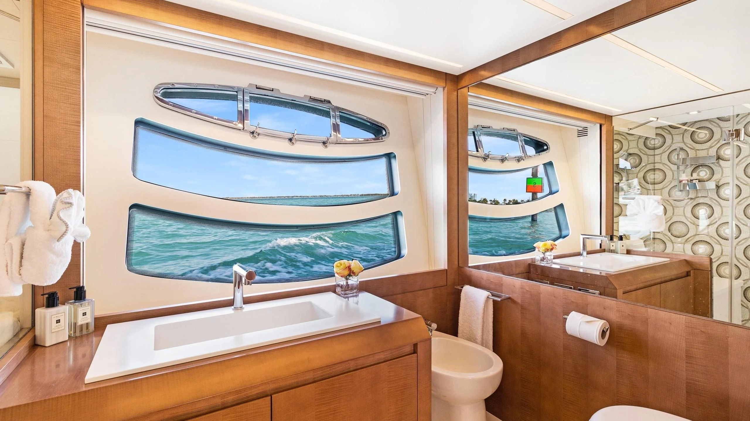 a bathroom with a large blue fish tank aboard VIXEN Yacht for Sale