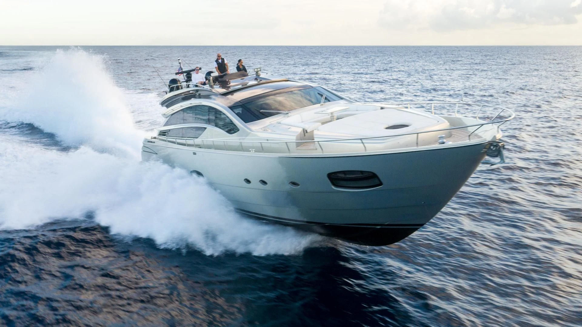 a white yacht on the water aboard VIXEN Yacht for Sale