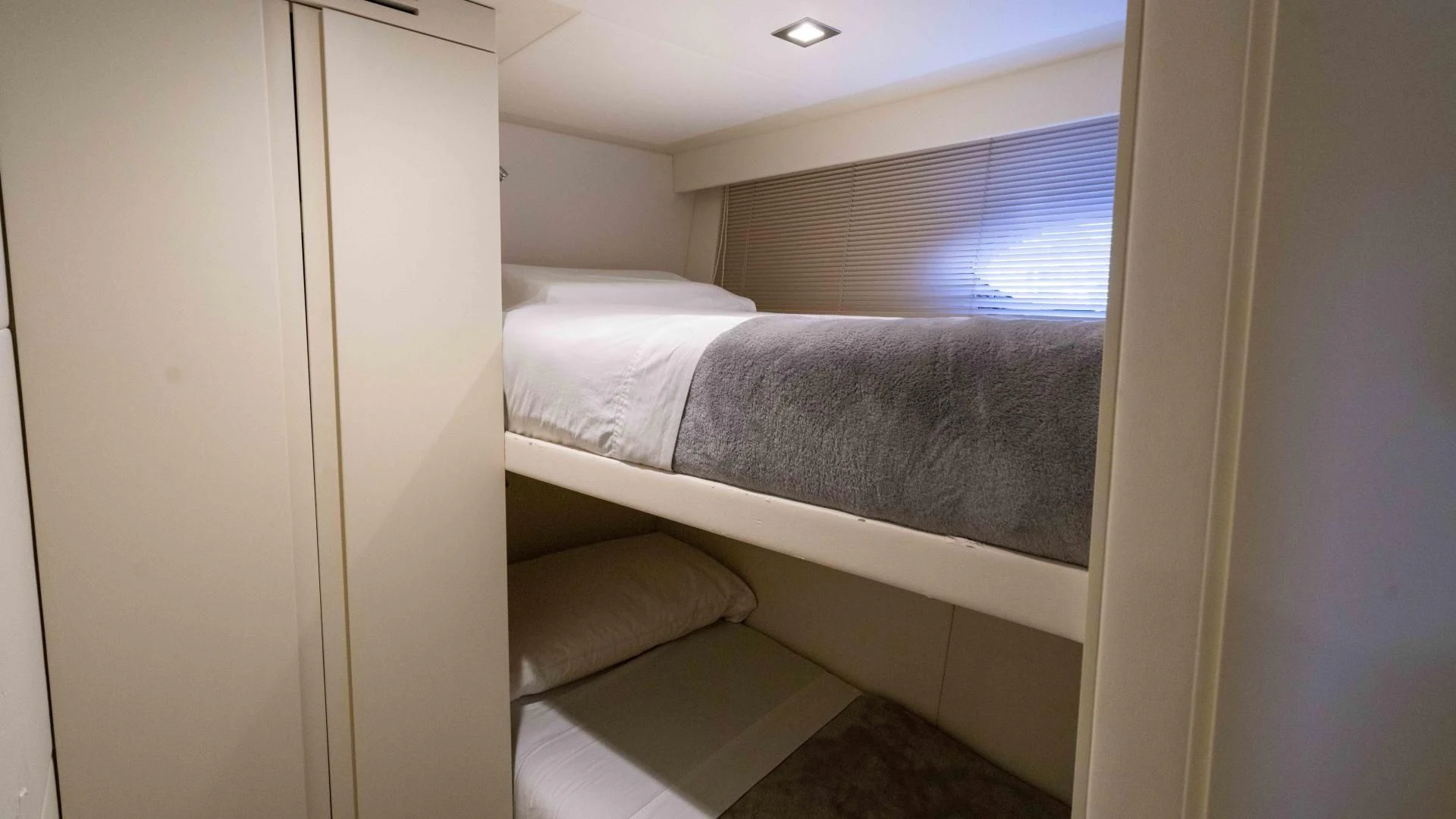 a bed with a white sheet aboard VIXEN Yacht for Sale