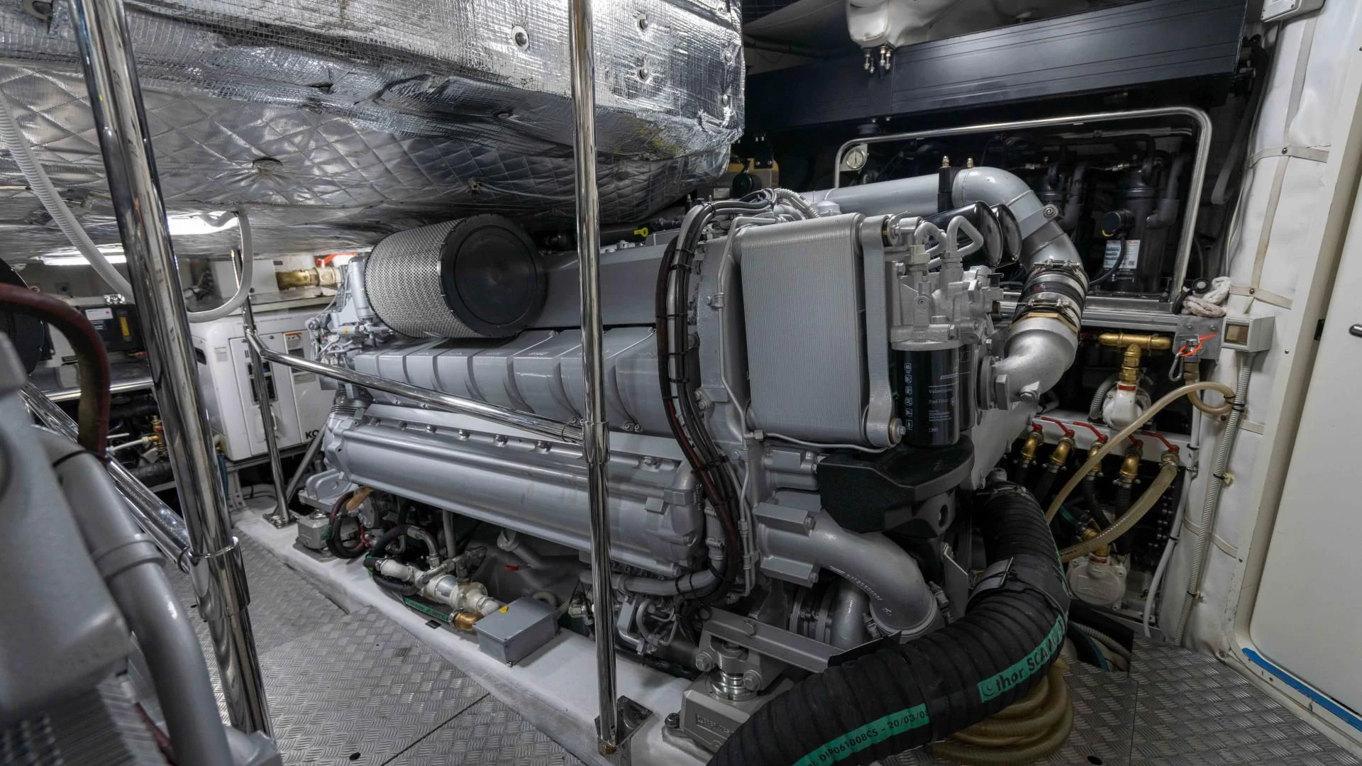 a car engine with a large pipe aboard VIXEN Yacht for Sale