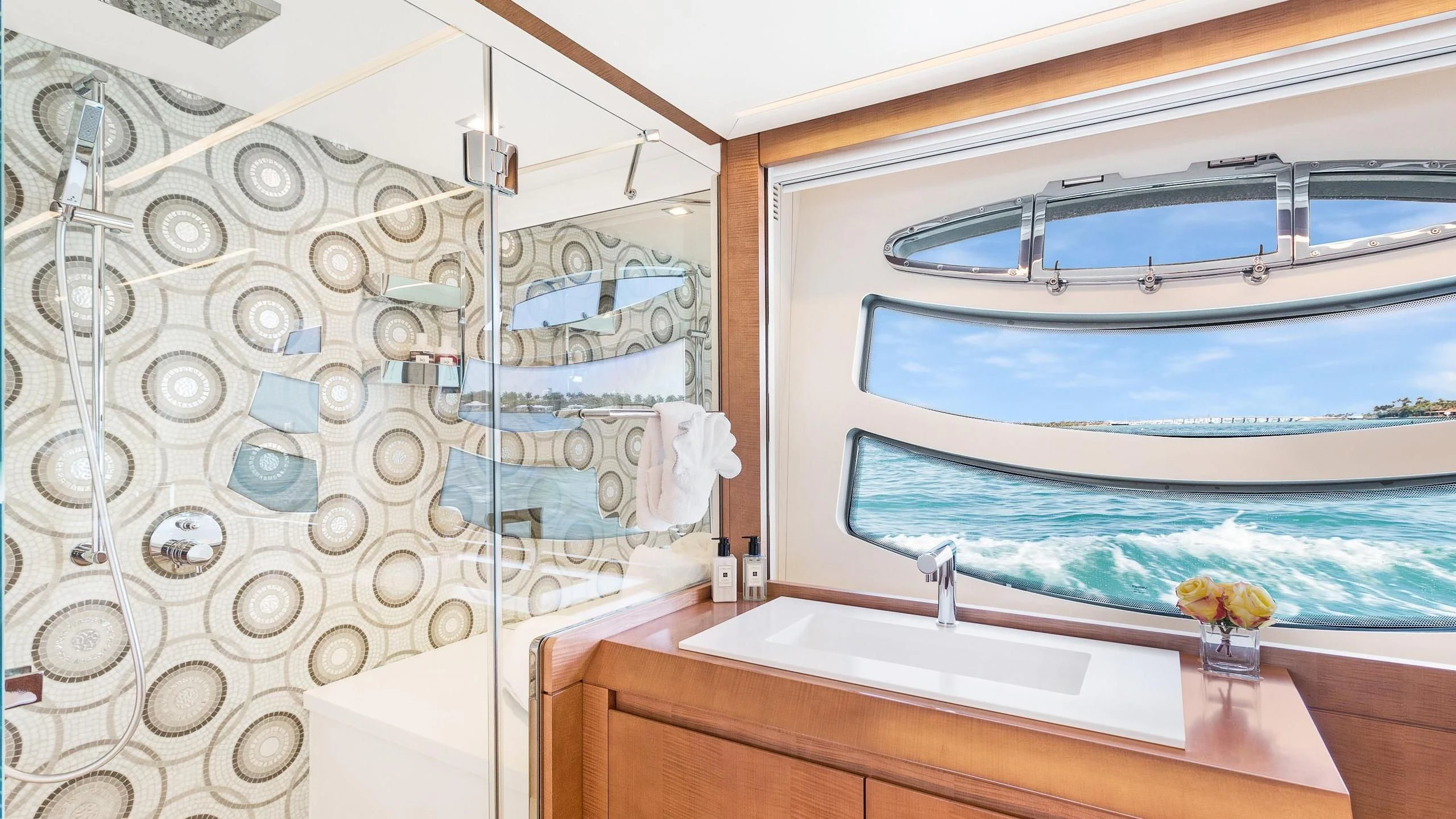 a bathroom with a large glass window aboard VIXEN Yacht for Sale