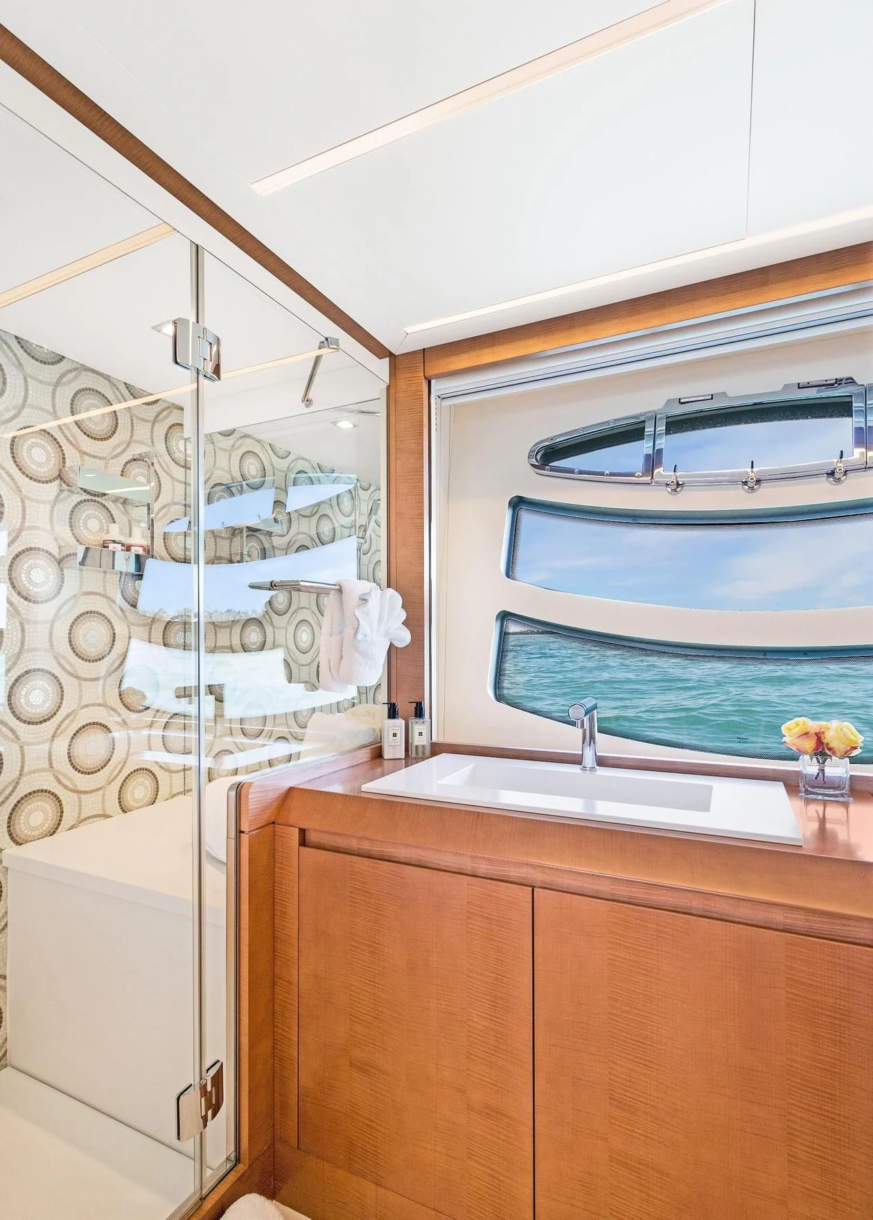 a bathroom with a shower and sink aboard VIXEN Yacht for Sale