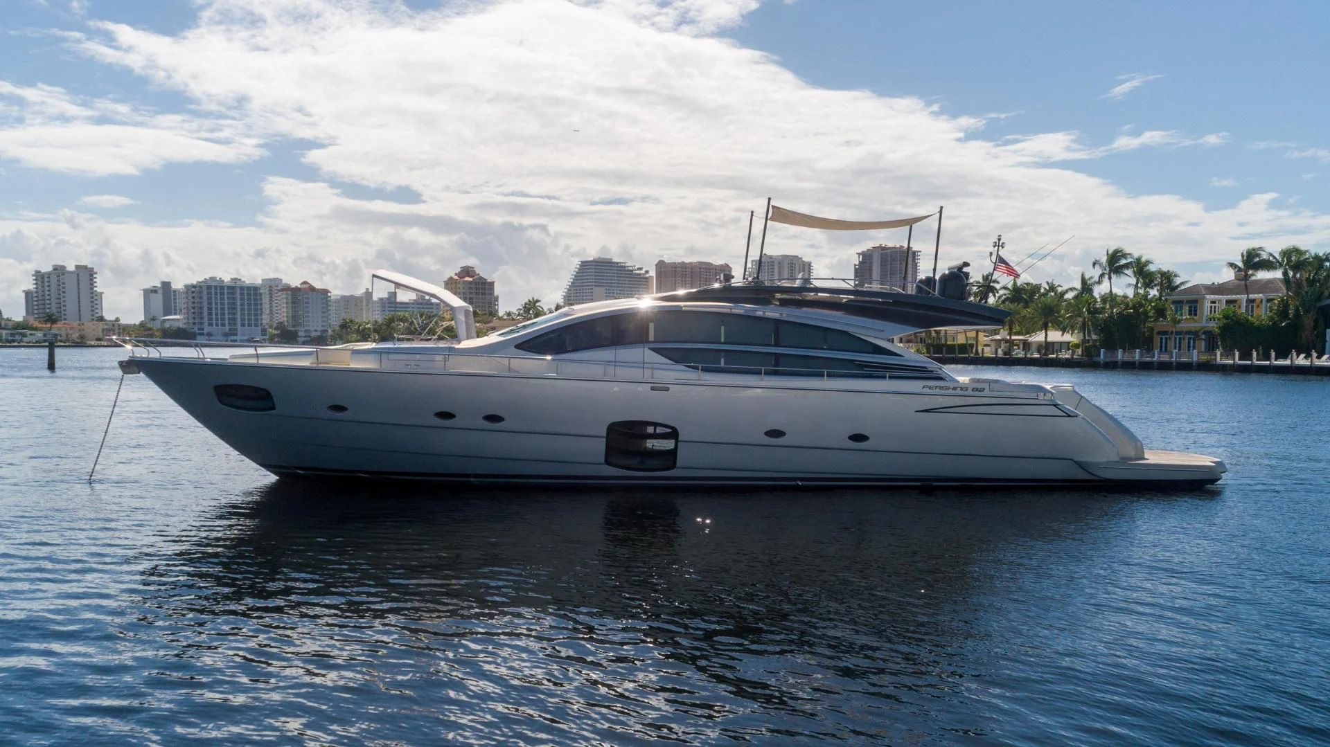 a white yacht on the water aboard VIXEN Yacht for Sale