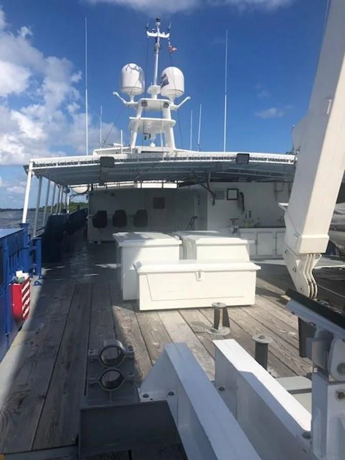 a ship docked at a pier aboard OCEANUS V Yacht for Sale