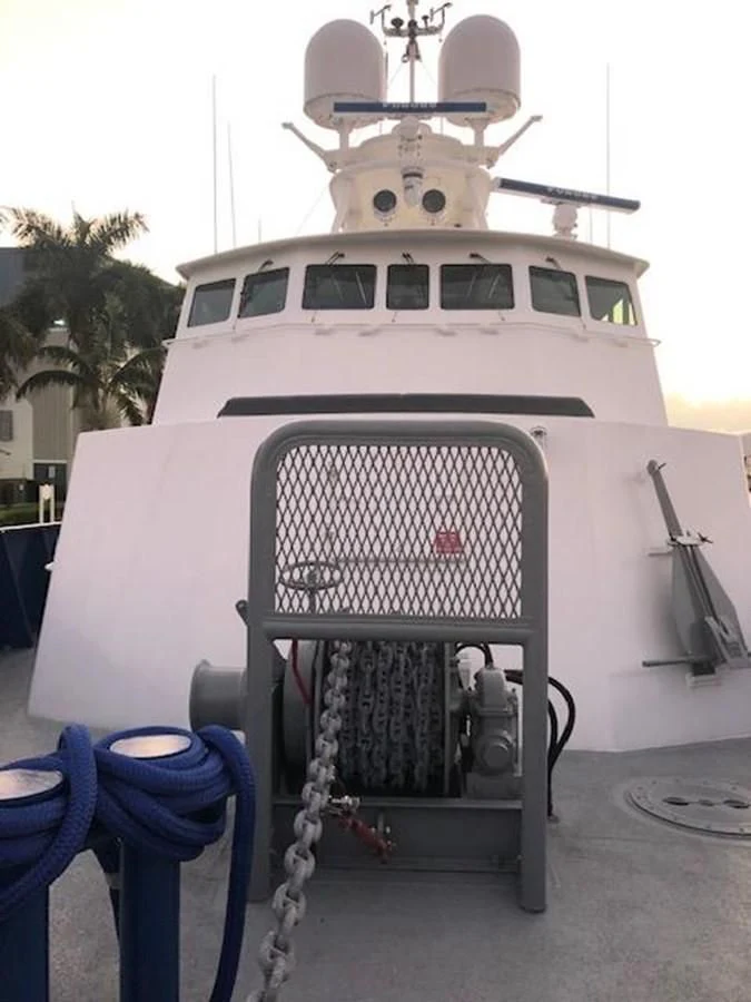 a white boat with a metal rack aboard OCEANUS V Yacht for Sale