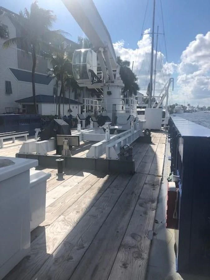 a dock with a boat on it aboard OCEANUS V Yacht for Sale