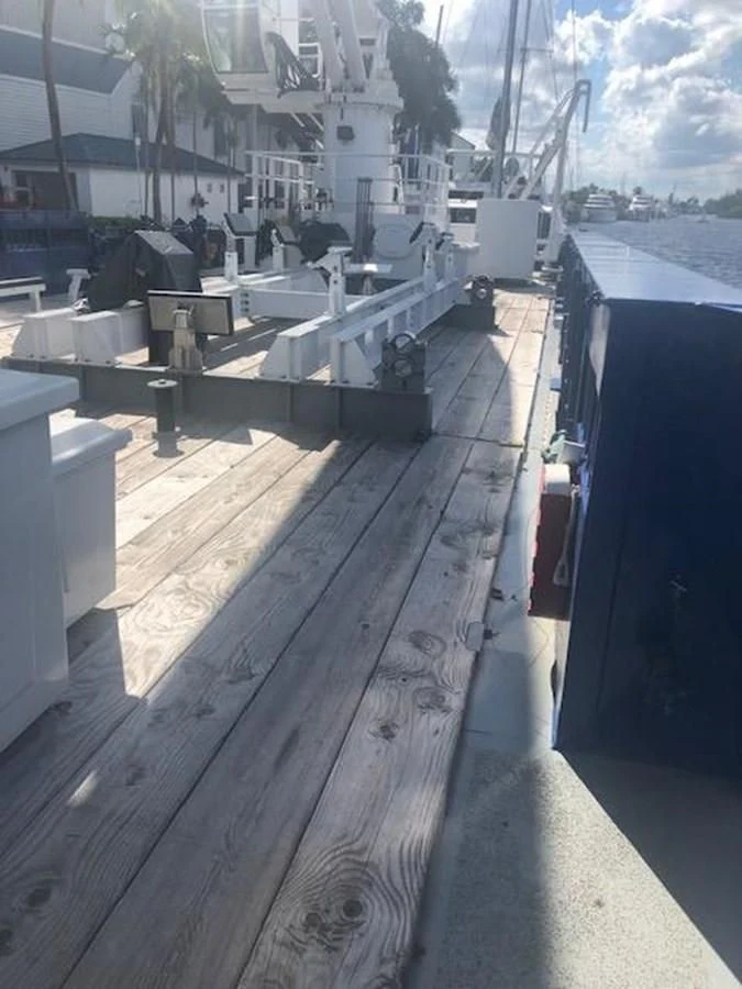 a dock with a boat on it aboard OCEANUS V Yacht for Sale