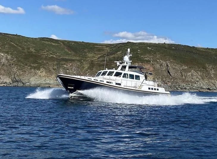 a boat on the water aboard BLUE LEGEND Yacht for Sale
