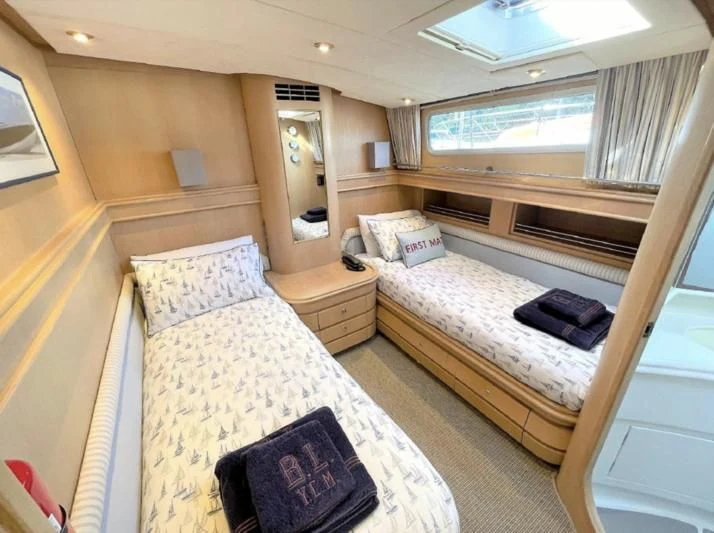 a room with two beds aboard BLUE LEGEND Yacht for Sale