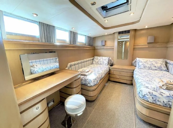 a room with a bed and a desk aboard BLUE LEGEND Yacht for Sale