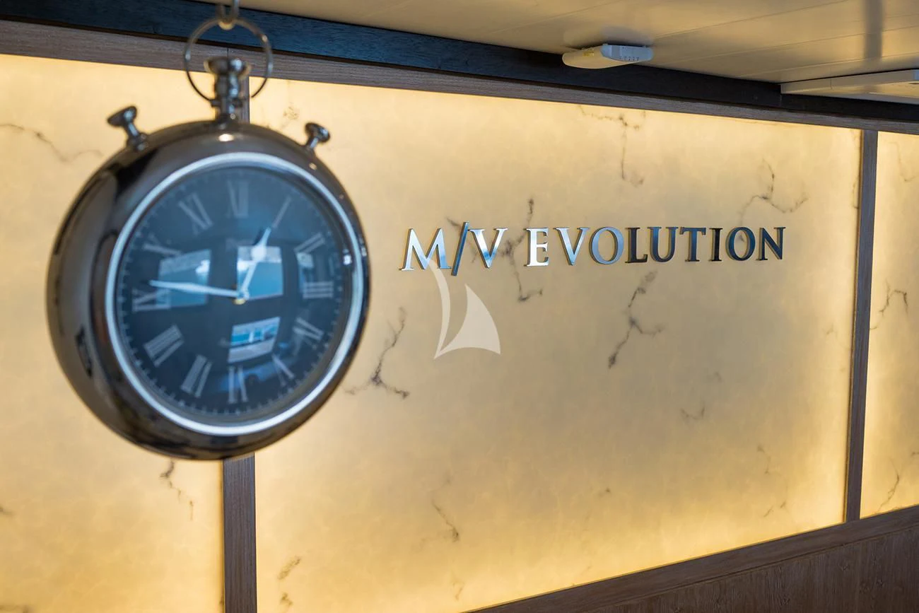 a clock on a wall aboard EVOLUTION Yacht for Sale