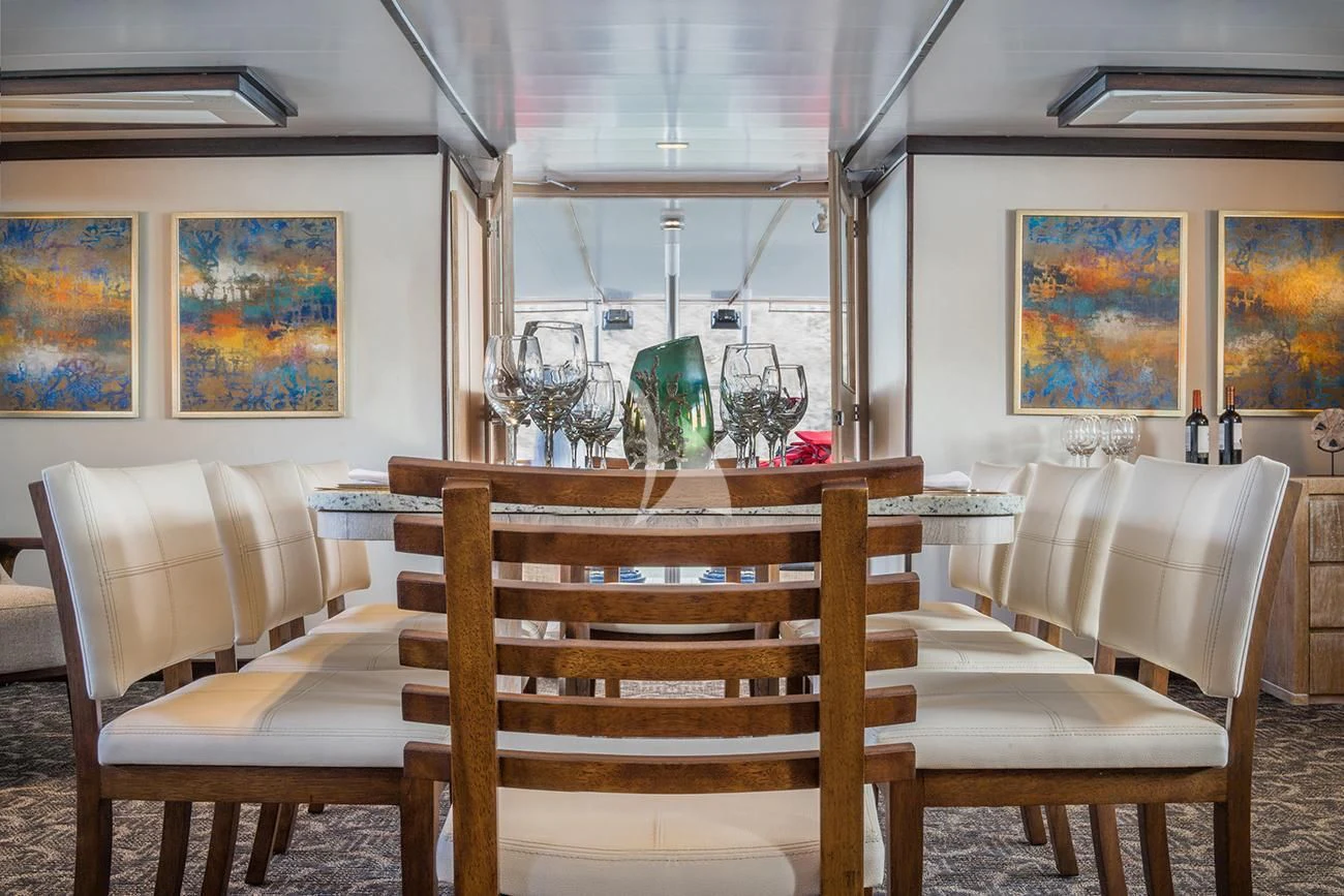 a room with a piano and a bench aboard EVOLUTION Yacht for Sale