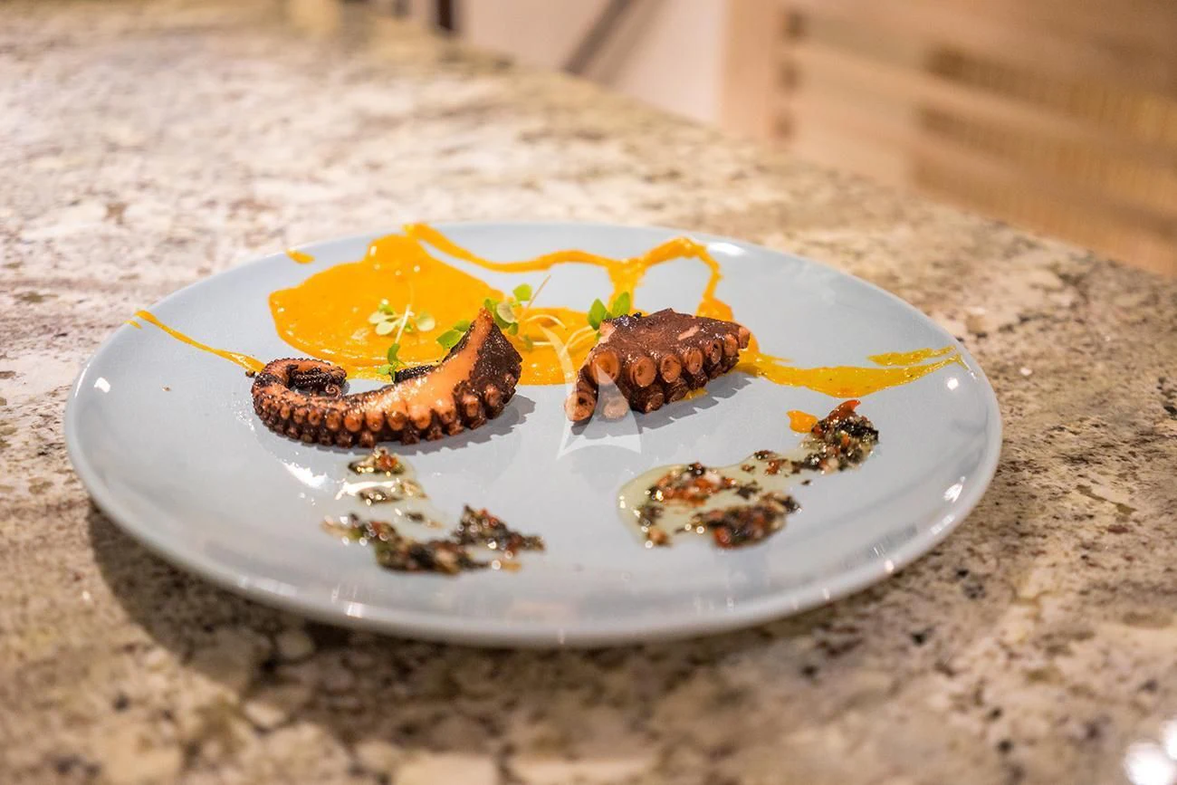 a plate of food aboard EVOLUTION Yacht for Sale