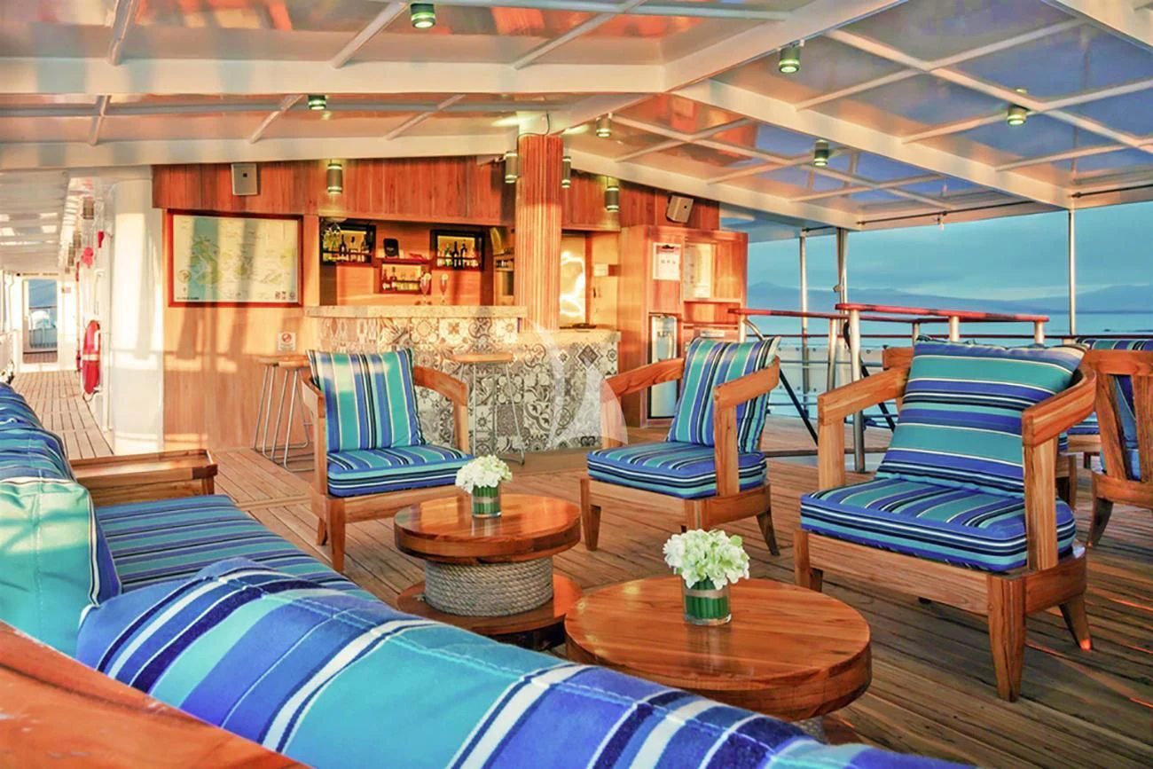 a room with chairs and tables aboard EVOLUTION Yacht for Sale