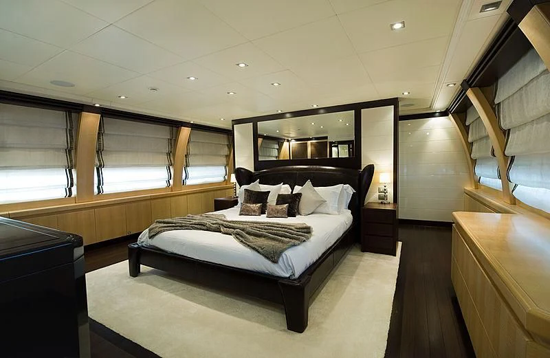 a large bedroom with a large bed aboard LIBERDADE Yacht for Sale