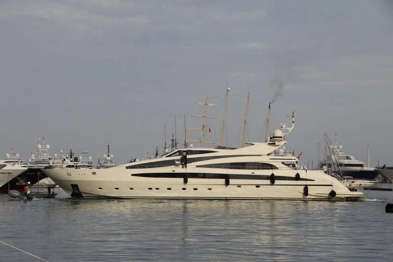 a white yacht in a harbor aboard LIBERDADE Yacht for Sale
