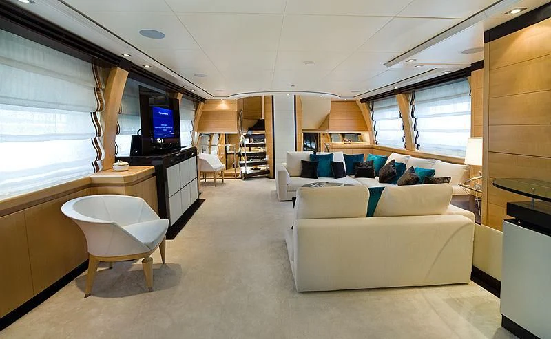 a room with a couch and a tv aboard LIBERDADE Yacht for Sale