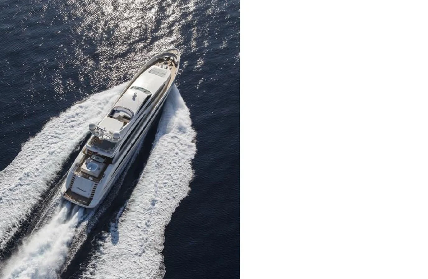 a military vehicle driving on a road aboard LIBERDADE Yacht for Sale