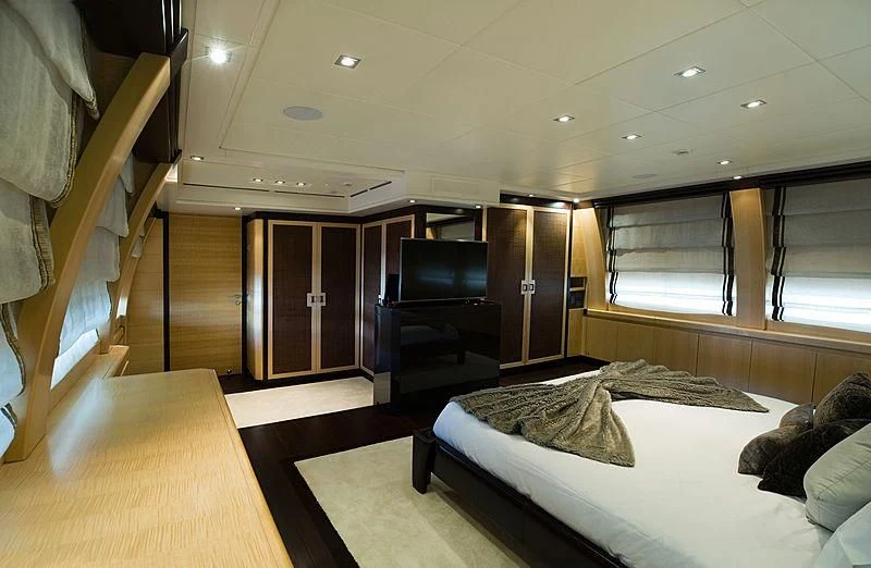 a room with a bed and a piano aboard LIBERDADE Yacht for Sale
