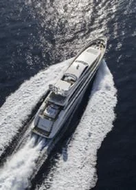 a military tank driving on a dirt road aboard LIBERDADE Yacht for Sale