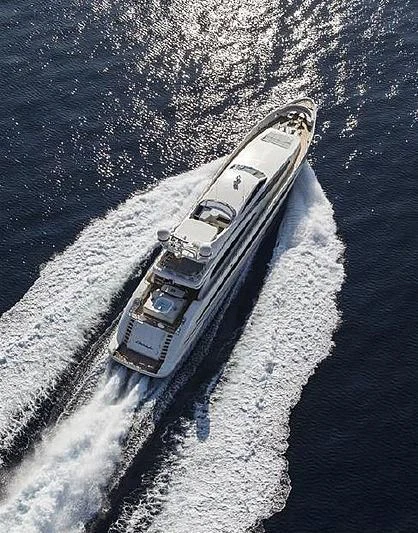 a space shuttle flying over a planet aboard LIBERDADE Yacht for Sale